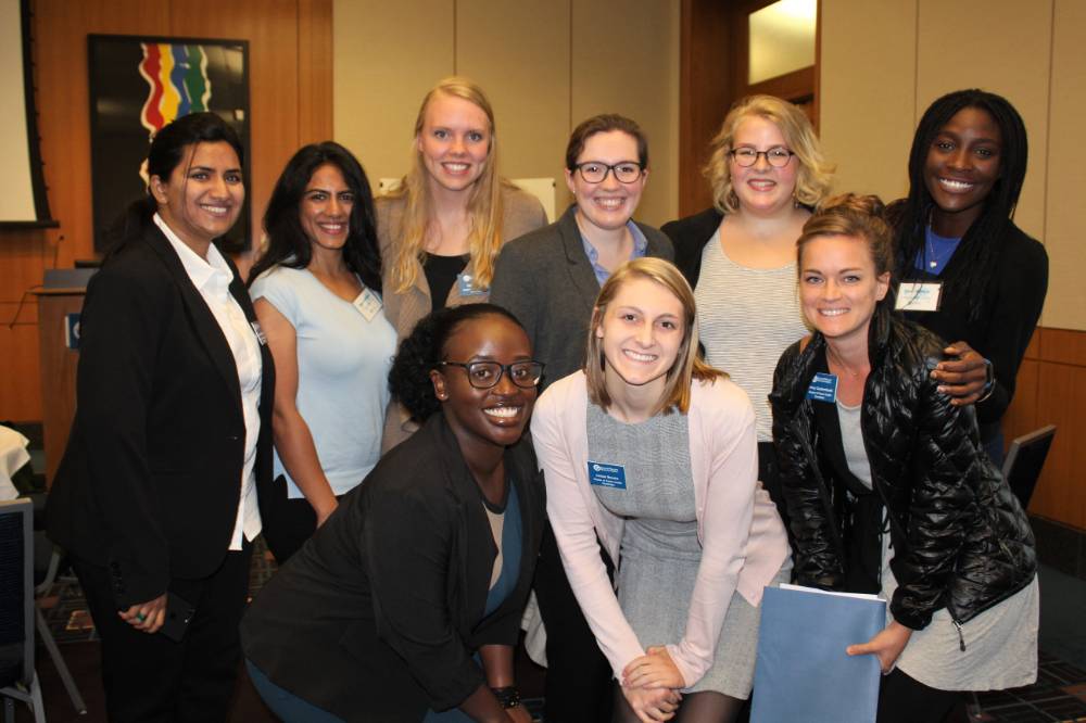 Image 1 of 15 A group of women standing together, smiling